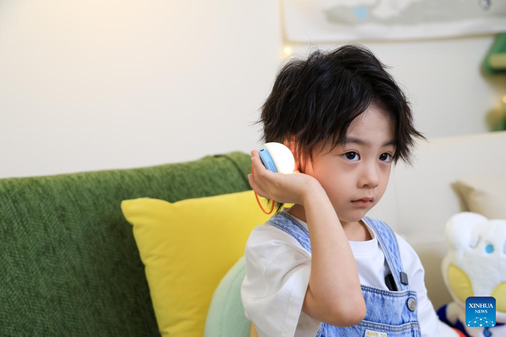 Child interacts with AI toy Ropet at inno100 flagship store